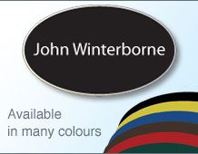 Oval badge 67x40mm in coloured frame with 1 line of text