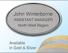 Oval 67x40mm badge with 3 lines of text in Gilt/Chrome frame